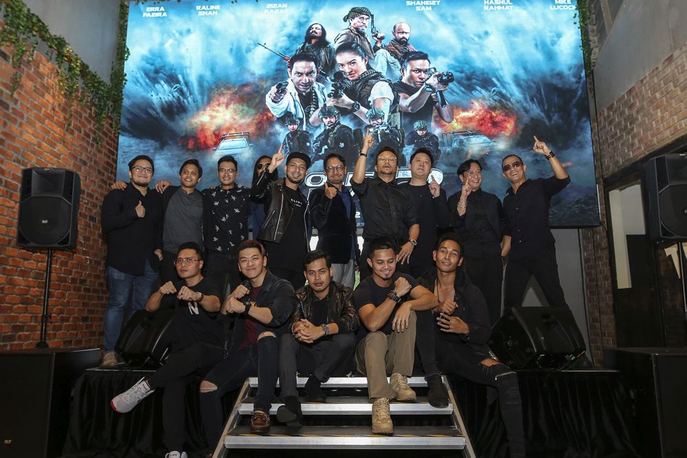 The cast of u00e2u20acu02dcPolis Evo 2u00e2u20acu2122 pose for a group photo during the filmu00e2u20acu2122s launch at The Gasket Alley in Petaling Jaya October 12, 2018.  u00e2u20acu201d Picture by Azneal Ishak