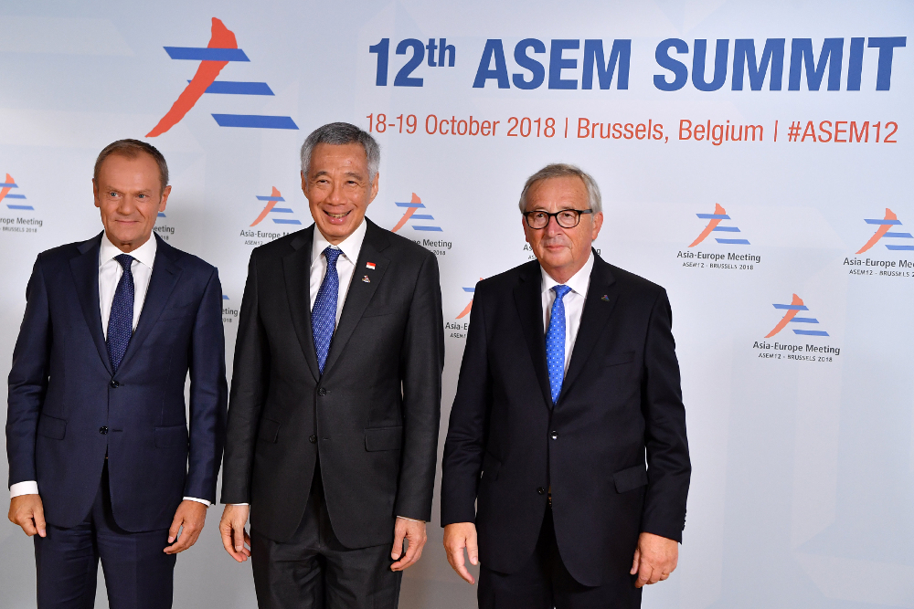 European Commission President Jean-Claude Juncker and European Council President Donald Tusk welcome Singapore's Prime Minister Lee Hsien Loong to the ASEM leaders summit in Brussels October 18, 2018. u00e2u20acu201d Picture by Ben Stansall/Pool via Reuters