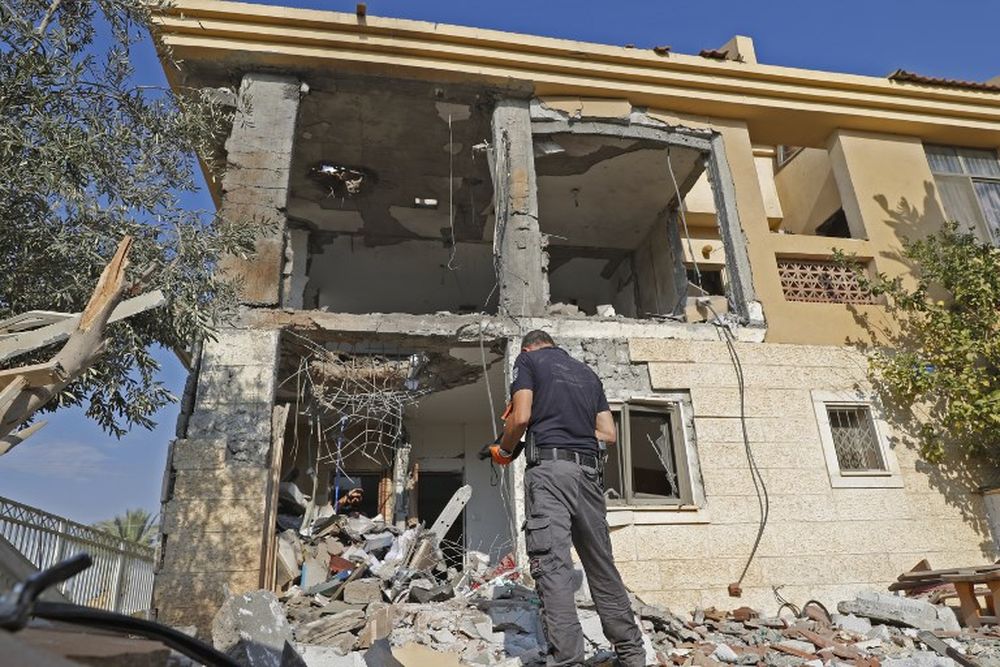 An Israeli sapper checks a house after it was hit by a rocket fired from the Hamas-run Palestinian Gaza Strip, one of the first projectiles fired in recent weeks from Gaza, on the central Israeli city of Bersheva on October 17, 2018. u00e2u20acu201d AFP pic