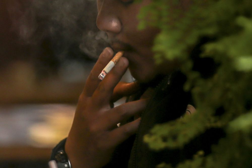A patron smokes at a restaurant in Bangsar October 9, 2018. u00e2u20acu2022 Picture by Hari Anggara