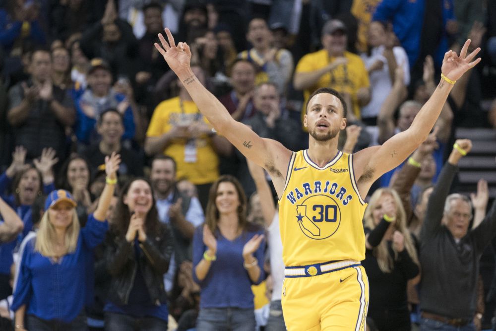 Golden State Warriors guard Stephen Curry (30) celebrates after making a three-point basket against the Washington Wizards during the third quarter at Oracle Arena. u00e2u20acu2022 Picture by Kyle Terada-USA TODAY Sports via Reuters