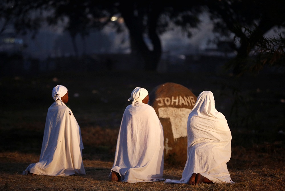 Zimbabwean women pray before casting their ballots in the country's general elections in Harare, Zimbabwe, July 30, 2018. u00e2u20acu201d Reuters pic      