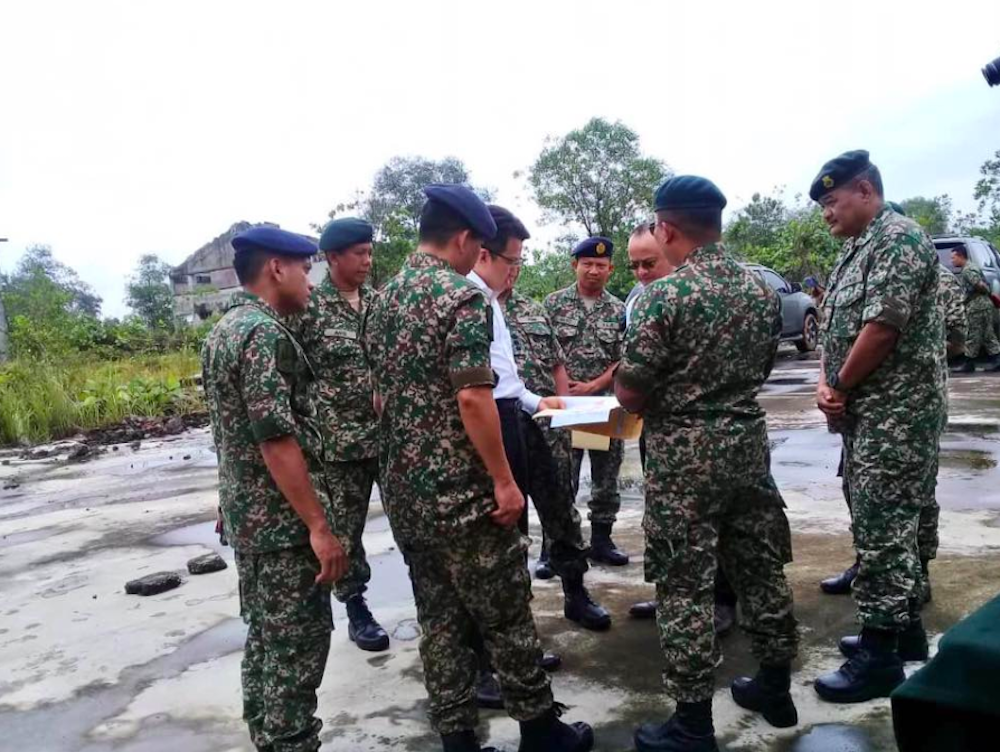 Deputy Defence Minister Liew Chin Tong speaks with officers at the Tebrau Army Camp during his visit today. u00e2u20acu201d Picture courtesy of Facebook/Liew Chin Tong