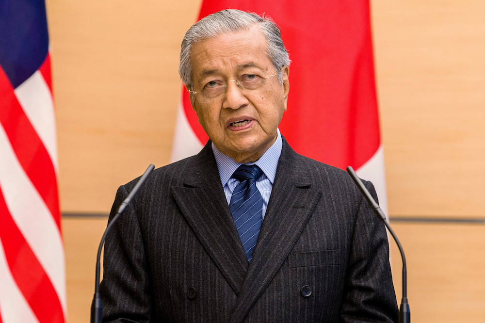 Tun Dr Mahathir today said the Malaysian government would also enact new laws that would facilitate the private sector doing business in Malaysia. u00e2u20acu201d Bernama pic