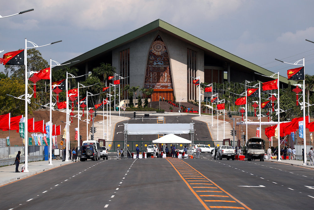 Chinese and Papua New Guinea national flags are seen lining a street in front of the parliament building in central Port Moresby November 15, 2018. u00e2u20acu201d Reuters pic