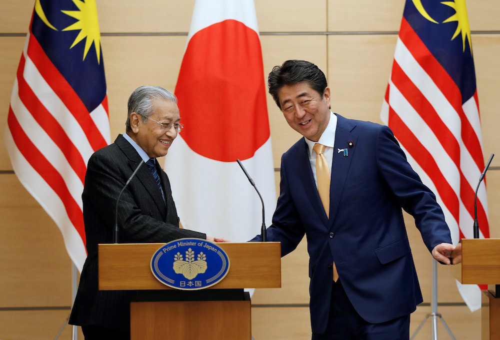 Prime Minister Tun Dr Mahathir Mohamad exchanges smiles with Japanu00e2u20acu2122s Prime Minister Shinzo Abe at the end of their joint news conference at Abeu00e2u20acu2122s official residence in Tokyo November 6, 2018. u00e2u20acu201d Reuters pic