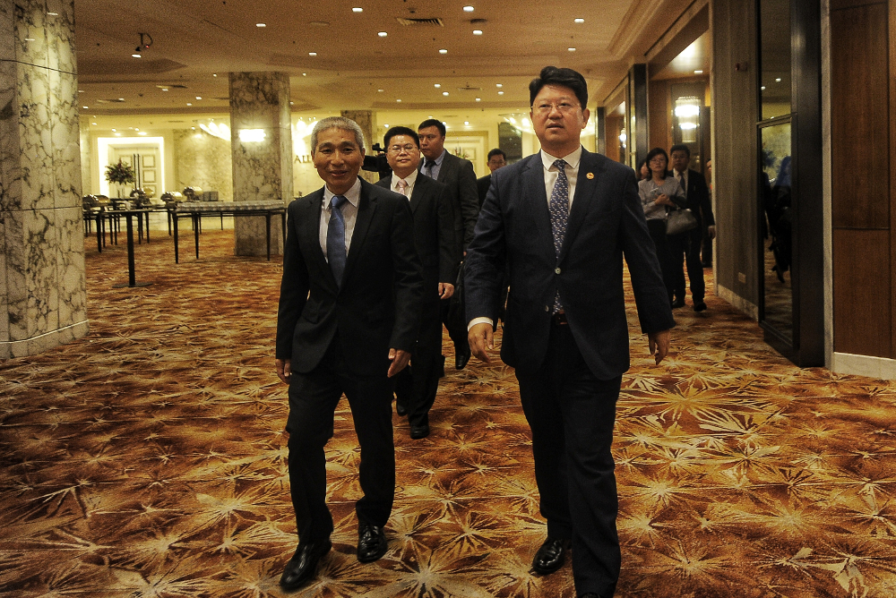 (From left) Deputy D-G of Fujian provincial foreign affairs office Li Hong and ambassador Bai Tian arrive during the China-Malaysia Youth Exchange & Fellowship Programme in Kuala Lumpur November 1, 2018. u00e2u20acu201d Picture by Shafwan Zaidon