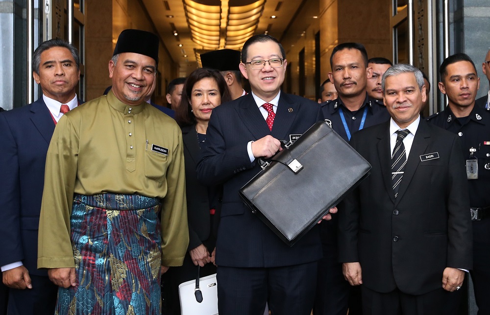 Finance Minister Lim Guan Eng (centre) heads to Parliament for the tabling of Budget 2019, in Putrajaya November 2, 2018. u00e2u20acu201d  Picture by Azinuddin Ghazali
