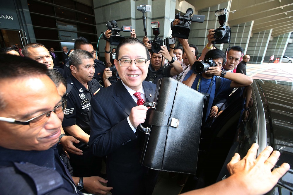 Finance Minister Lim Guan Eng (centre) heads to Parliament for the tabling of Budget 2019, in Putrajaya November 2, 2018. u00e2u20acu201d  Picture by Azinuddin Ghazali