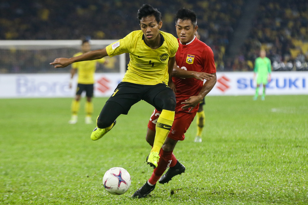 Malaysia’s Muhammad Syahmi Safari in action during the AFF Suzuki Cup group A match against Laos in Kuala Lumpur November 12,2018. — Picture by Ahmad Zamzahuri