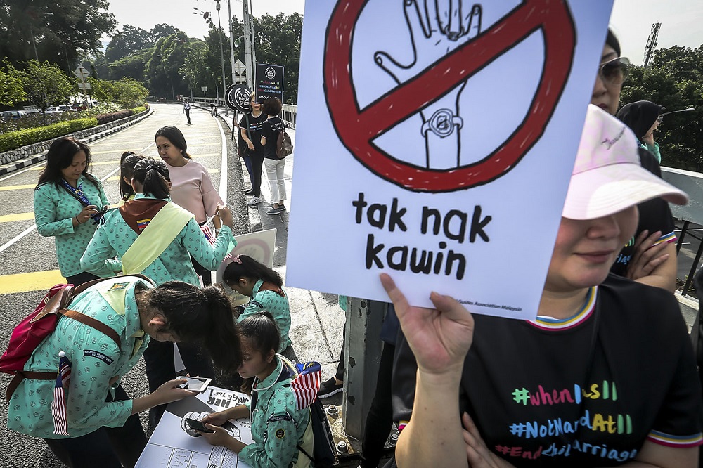 Activists and students protest against child marriage outside the Parliament in Kuala Lumpur November 13, 2018. u00e2u20acu201d Picture by Hari Anggara