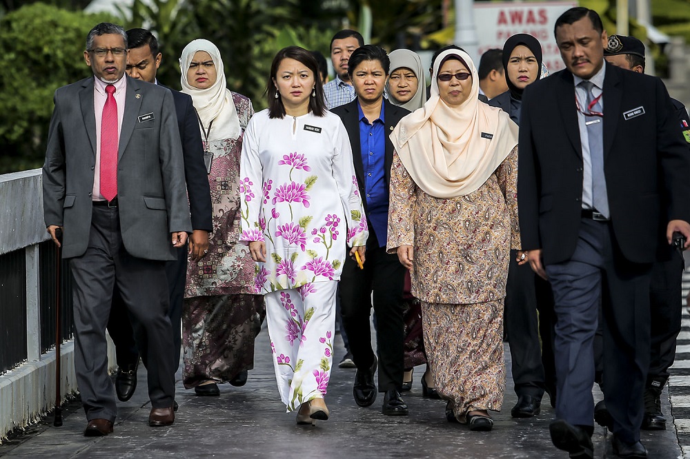 Mohamed Hanipa Maidin (left), Hannah Yeoh (centre) and Fuziah Salleh (second right) arrive at the Anti-child marriage protest outside the Parliament in Kuala Lumpur November 13, 2018.