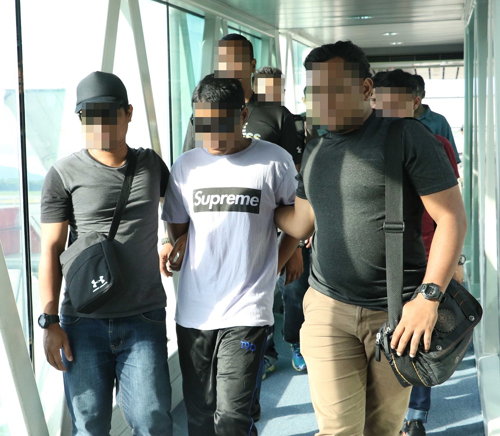 A suspect with alleged links to terrorist groups is arrested in Tenom, Sabah. u00e2u20acu201d Picture courtesy of Bukit Aman 