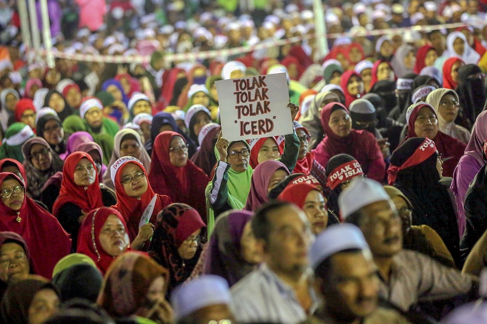 Umno and PAS members, and NGOs, attend an ICERD protest in Kampung Gajah, Perak November 17, 2018. u00e2u20acu201d Picture by Farhan Najib