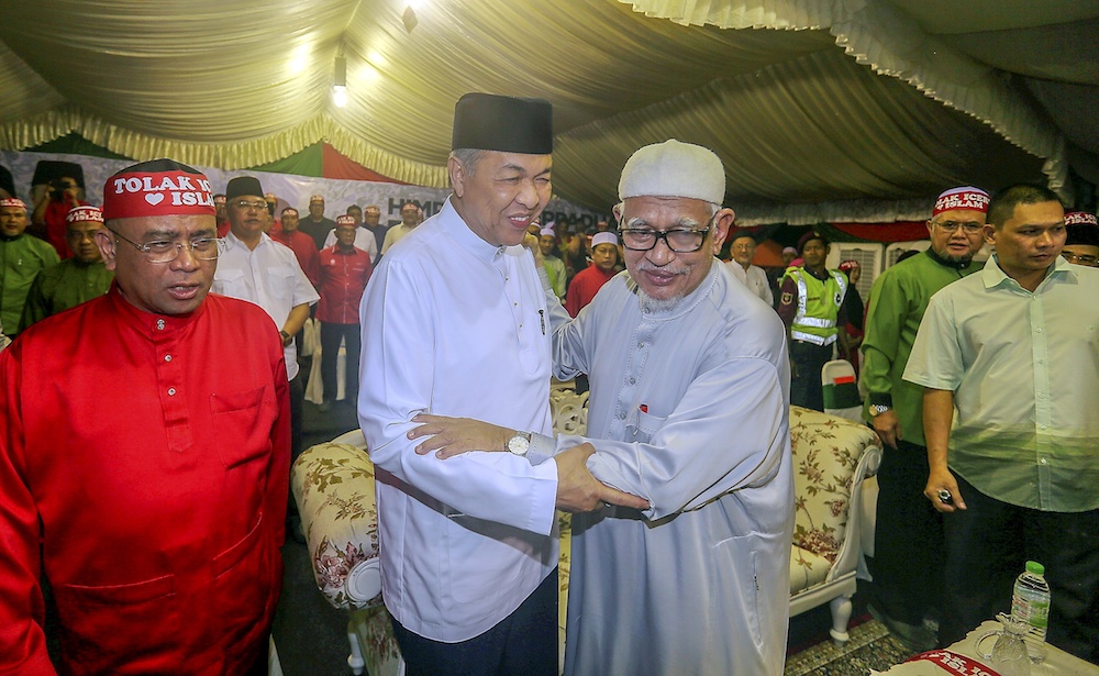 Umno President Datuk Seri Ahmad Zahid Hamidi and PAS President Datuk Seri Abdul Hadi Awang attend an ICERD protest in Kampung Gajah, Perak November 17, 2018. u00e2u20acu201d Picture by Farhan Najib
