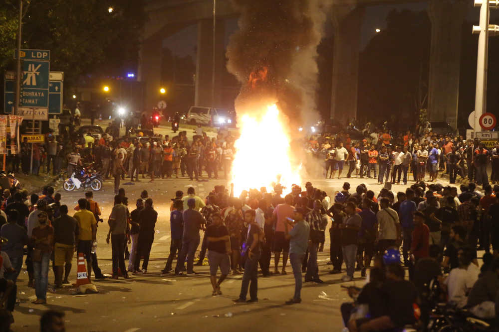 Several car wreckages were torched by the protesters that have gathered near the Sri Maha Mariamman temple compound as the protest enter its second day November 27, 2018. u00e2u20acu201d Picture by Azinuddin Ghazali