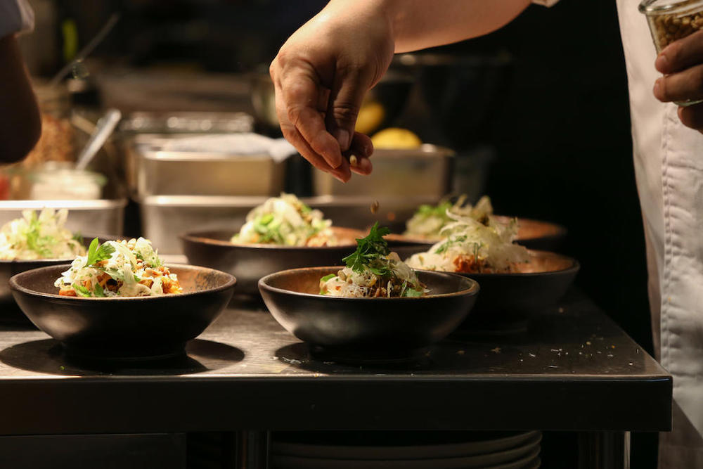 A close-up of chef Victor Loy preparing dishes during The Food Bank Singapore and Plentyfull food-tasting event for the One-Dish@A-Time initiative. u00e2u20acu201d Picture by Koh Mui Fong/TODAY