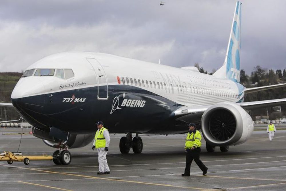 Ground crew members escort a Boeing 737 MAX as it returns from a flight test at Boeing Field in Seattle, Washington January 29, 2016. u00e2u20acu201d Reuters pic