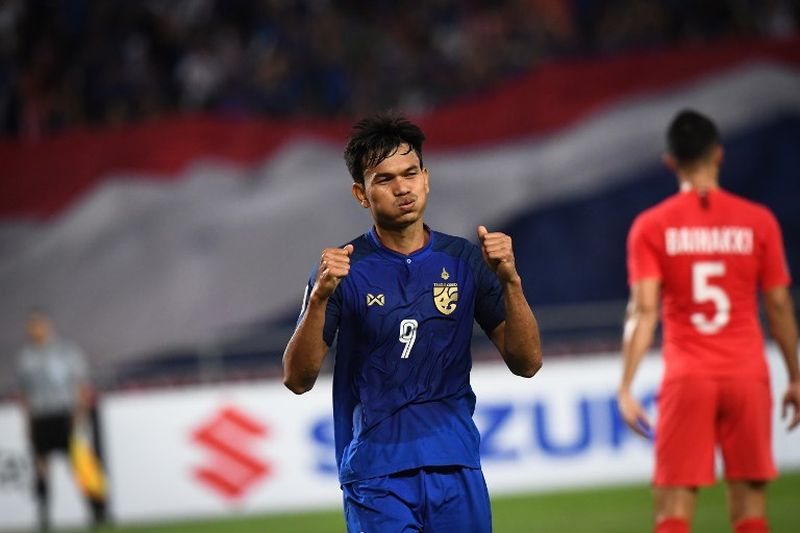 Thailand's Adisak Kraisorn celebrates after scoring the third goal against Singapore during the AFF Suzuki Cup 2018 football match in Bangkok November 25, 2018. u00e2u20acu2022 AFP pic