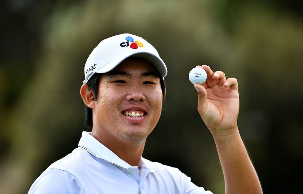 An Byeong-hun of South Korea posing with the ball after making a hole-in-one on hole 15 during round two of the Australian Open golf tournament at the Lakes Golf Club at Eastlakes in Sydney, November 16, 2018. u00e2u20acu201d Paul Lakatos/Lagardere Sports /AFP pic