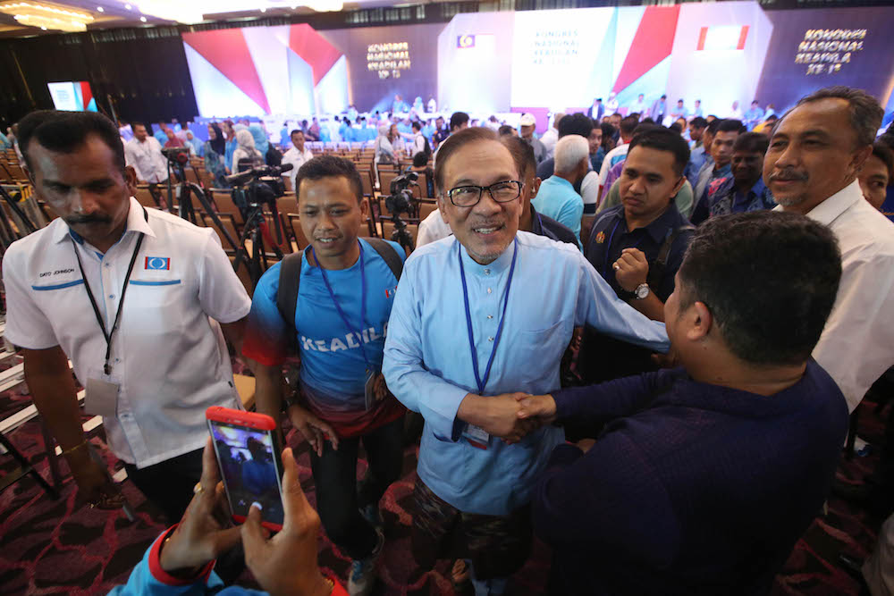 Datuk Seri Anwar Ibrahim greet PKR members at the partyu00e2u20acu2122s Annual Congress in Shah Alam, November 17, 2018. u00e2u20acu2022 Picture by Azinuddin Ghazalin