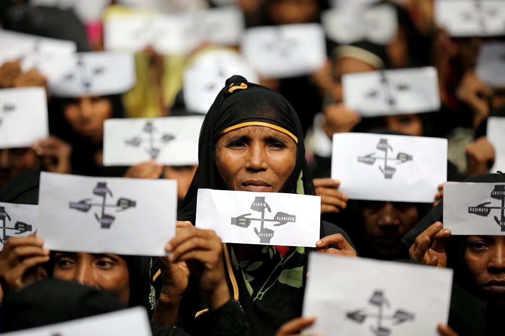 Rohingya refugee women hold placards as they take part in a protest at the Kutupalong refugee camp to mark the one-year anniversary of their exodus in Cox's Bazar, Bangladesh, August 25, 2018. u00e2u20acu201d Reuters pic
