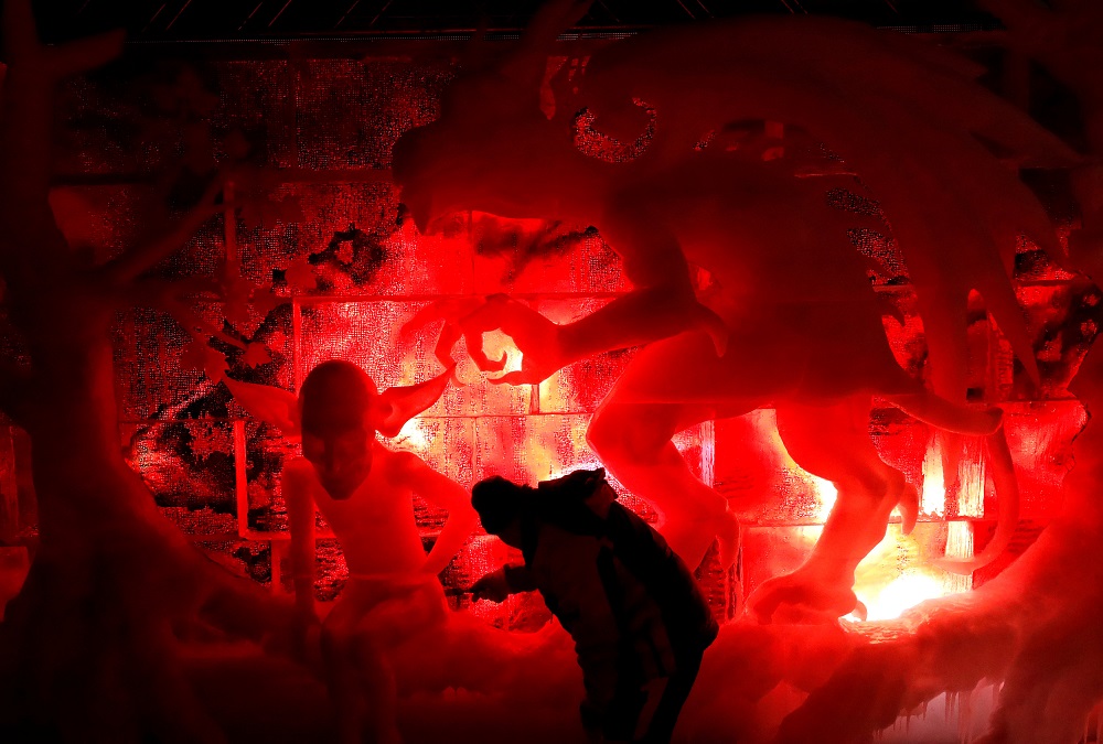 An artist carves an ice sculpture at the Bruges Ice Sculpture Festival and The Worldu00e2u20acu2122s First Digital Ice Art Museum in Bruges, Belgium November 22, 2018. u00e2u20acu201d Reuters pic