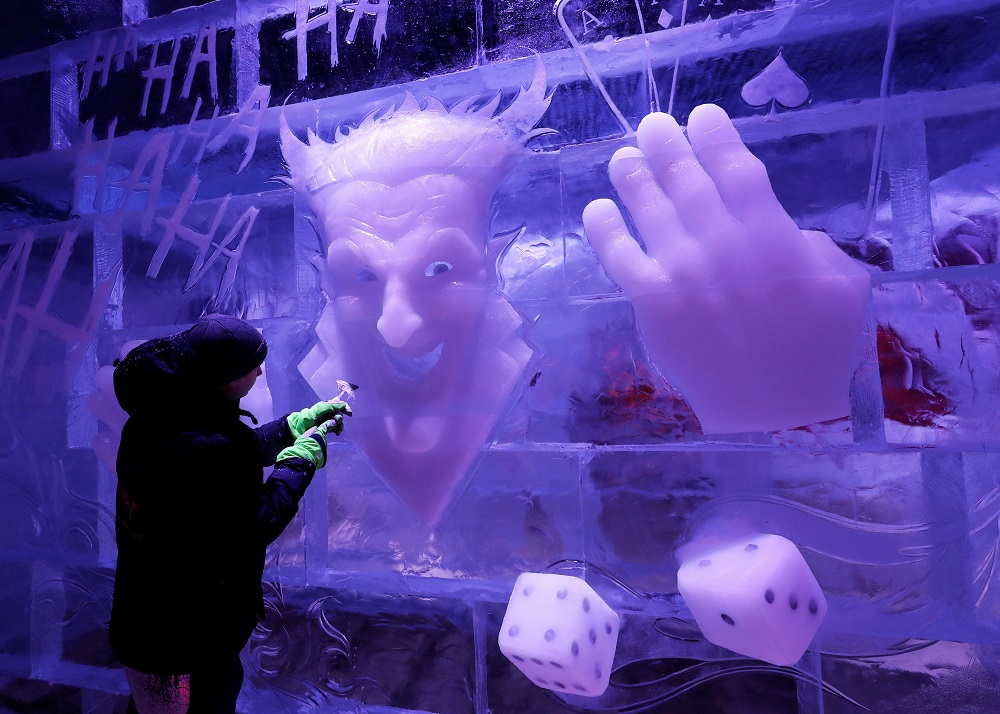 An artist carves an ice sculpture at the Bruges Ice Sculpture Festival and The World’s First Digital Ice Art Museum in Bruges, Belgium November 22, 2018. — Reuters pic