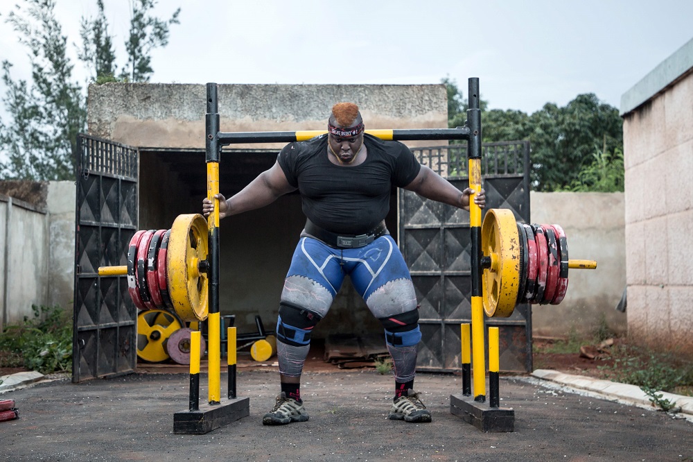 Cheick Ahmed Al-Hassan Sanou aka Iron Biby prepares to lift 505kg as he works out at his home of Bobo-Dioulasso, second biggest city of Burkina Faso September 23, 2018. u00e2u20acu201d AFP pic      