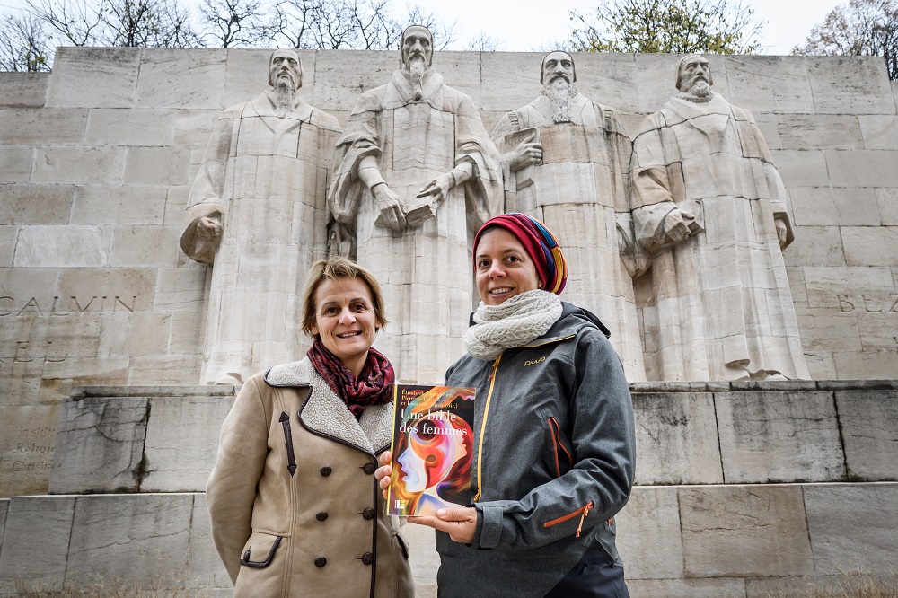 Geneva theology professors Lauriane Savoy (right) and Elisabeth Parmentier pose with an edition of 'A Women's Bible' on November 20, 2018 in Geneva. u00e2u20acu201d AFP pic
