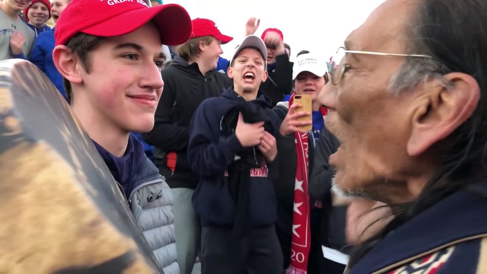 A student from Covington Catholic High School stands in front of Native American Vietnam veteran Nathan Phillips in Washington, US, in this still image from a January 18, 2019. u00e2u20acu201d Videograb by Kaya Taitano/Social Media via Reuters
