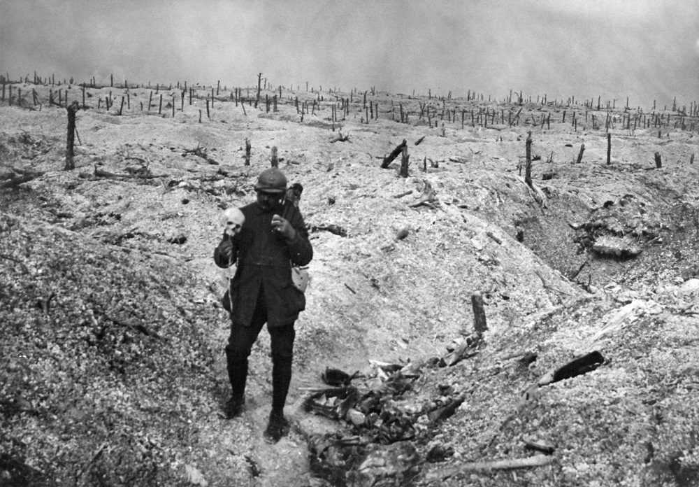 Undated picture released by the International Contemporary Documentation Library (BDIC) shows a French soldier holding a human skull on a battlefield during the First World War. u00e2u20acu201d AFP pic        