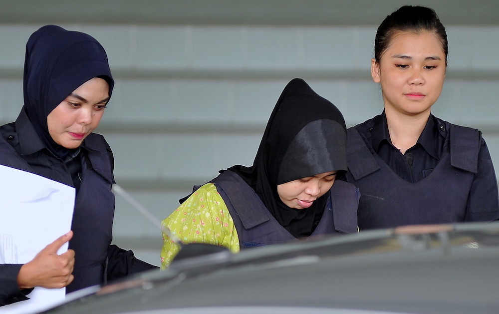 Indonesian Siti Aisyah, who is on trial for the killing of Kim Jong-nam is escorted as she arrives at the Shah Alam High Court November 7, 2018. u00e2u20acu201d Bernama pic