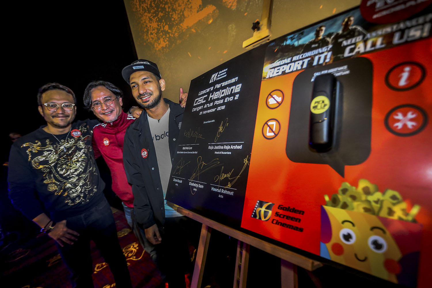 'Polis Evo 2' cast members Shaheizy Sam (left), Hasnul Rahmat and Zizan Razak (right) at the launch of GSC Helpline at GSC Pavilion KL -- Picture by Hari Anggara