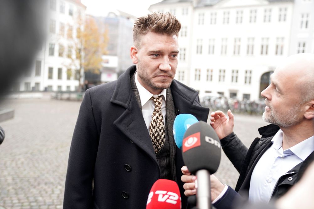 Denmark striker Nicklas Bendtner and lawyer Anders Nemeth speak to the media as they arrive at the Copenhagen City Council, Denmark November 2, 2018. u00e2u20acu2022 Reuters pic