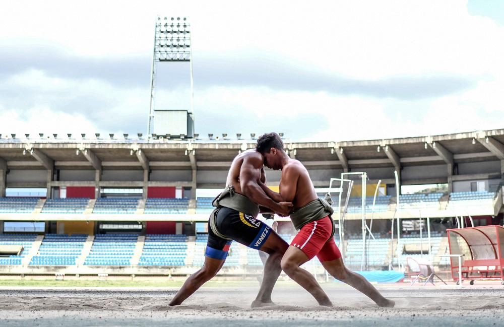 Venezuelan sumo wrestlers train at the Brigido Iriarte stadium in Caracas July 27, 2018. u00e2u20acu201d AFP pic  