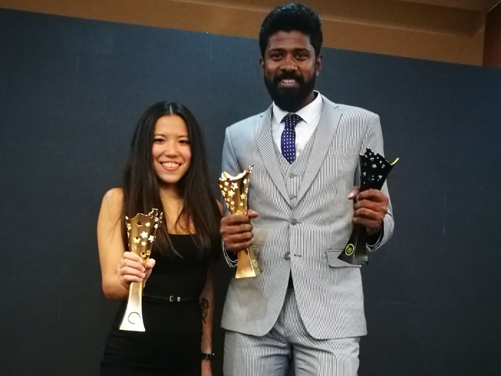 Santharuban (right) posing with his trophy.