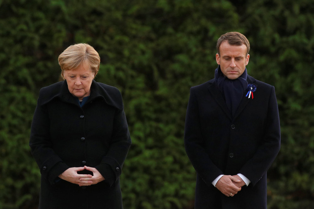 French President Emmanuel Macron and German Chancellor Angela Merkel stand together in the Clairiere of Rethondes during a commemoration ceremony for Armistice Day in Compiegne, France November 10, 2018. u00e2u20acu201d Reuters pic