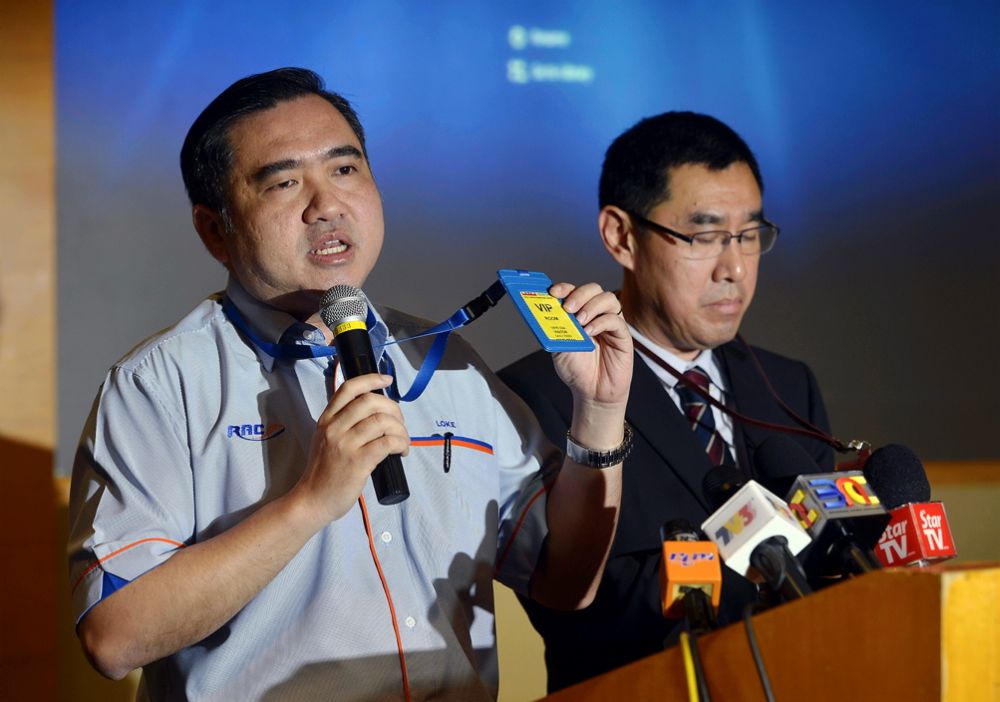 Transport Minister Anthony Loke showing the VIP security pass which every VIP accessing the special lounge must wear, after being screened at the entry. u00e2u20acu2022 Picture by Ham Abu Bakar
