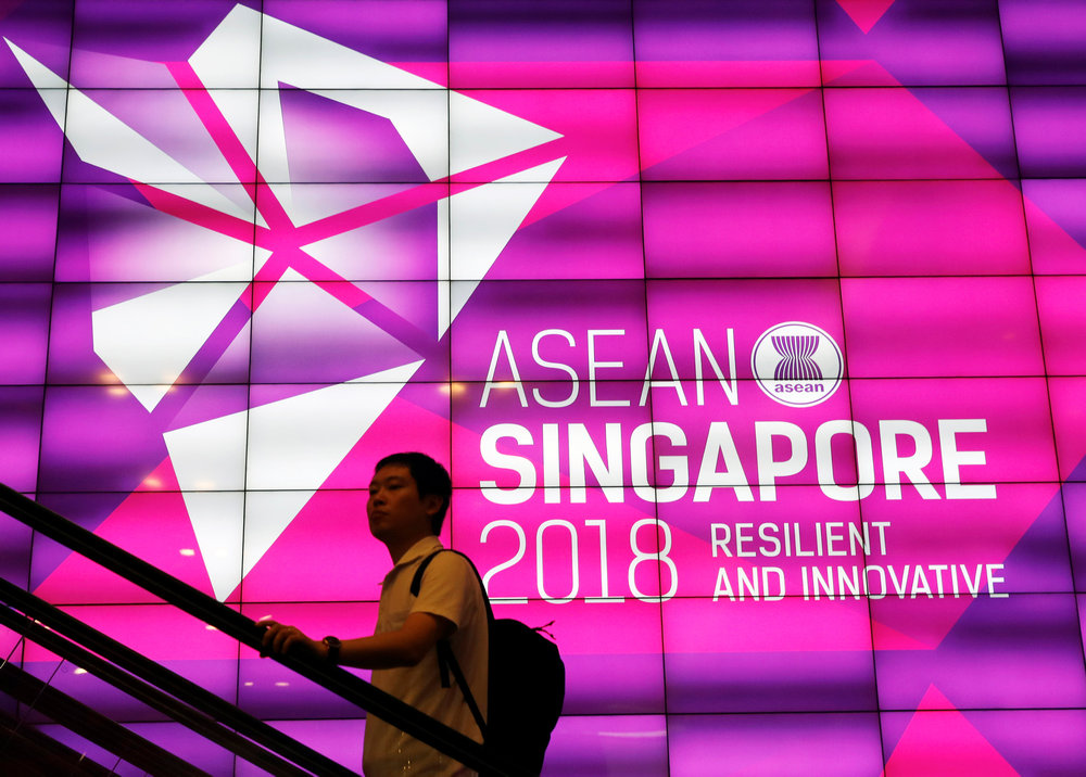 A man passes the Asean Summit signage at Suntec Convention Centre in Singapore, November 11, 2018. u00e2u20acu201d Reuters pic