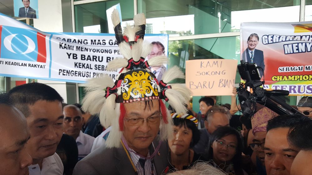 Works Minister Baru Bian being is welcomed by about 200 PKR members and supporters upon arrival at the Kuching International Airport , November 24, 2018. u00e2u20acu2022 Picture by Sulok Tawie