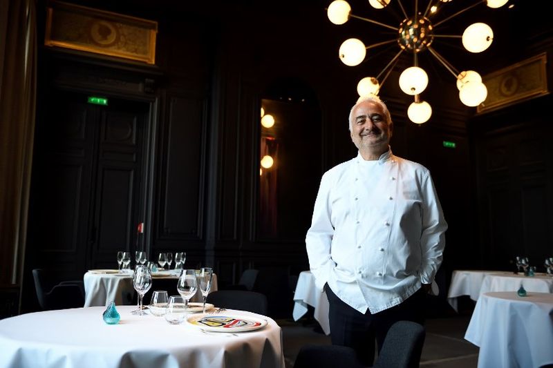 French chef Guy Savoy poses in the dining room of his Michelin three-starred restaurant u00e2u20acu02dcRestaurant Guy Savoyu00e2u20acu2122 in Paris. u00e2u20acu2022 AFP pic