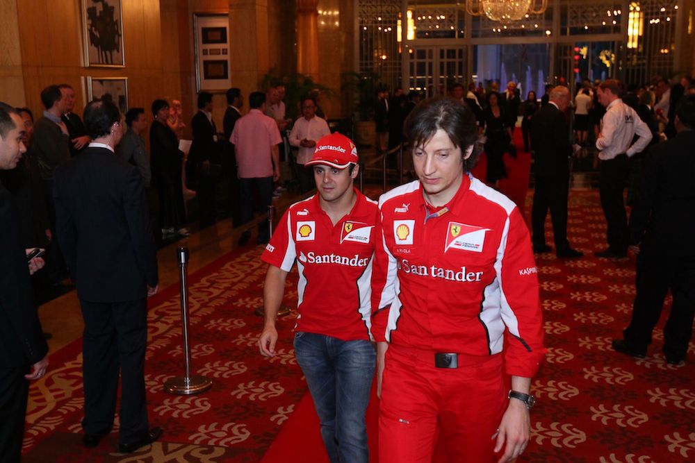 Then Ferrari driver Felipe Massa (left) arrives with a team member at the 2012 gala. — Picture courtesy of MAF