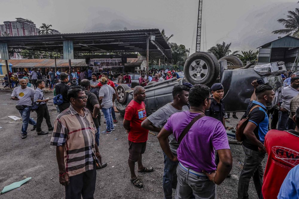 The scene outside the Sri Mara Mariamman Temple in Putra Heights. Eighteen cars and two motorcycles were torched during the incident that started at about 2am. u00e2u20acu2022 Picture by Firdaus Latif
