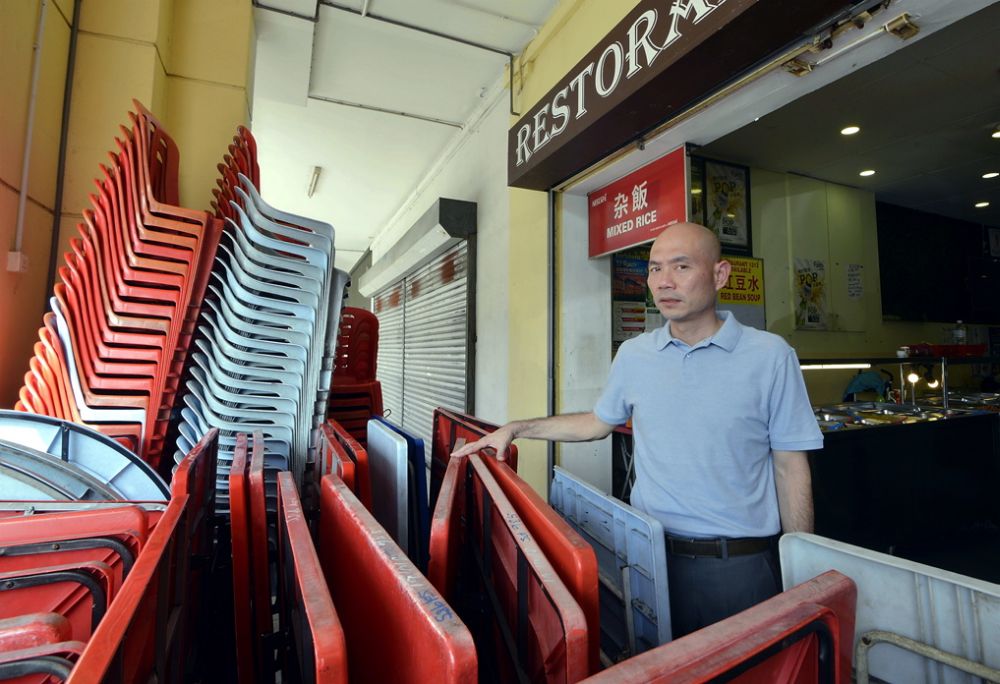 MP Lim Lip Eng points at some tables and chairs stacked by the corridor of a restaurant in Kepong. u00e2u20acu2022 Picture by Ham Abu Bakar