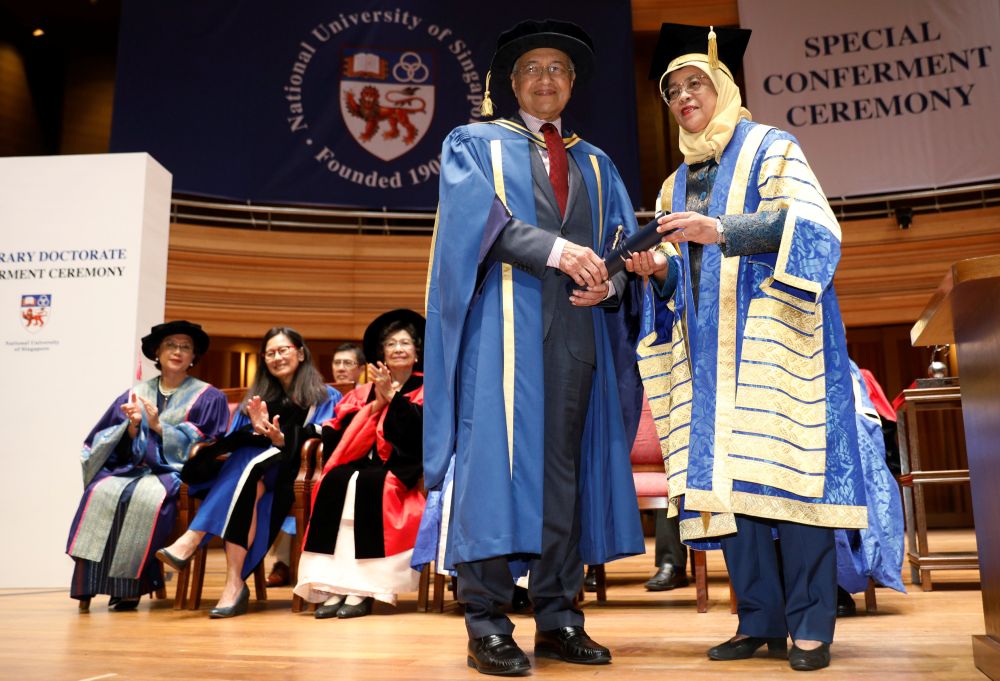 Malaysia's Prime Minister Tun Dr Mahathir Mohamad is conferred an honorary Doctor of Laws degree by Singapore's President Halimah Yacob at the National University of Singapore November 13, 2018. u00e2u20acu201d Reuters pic