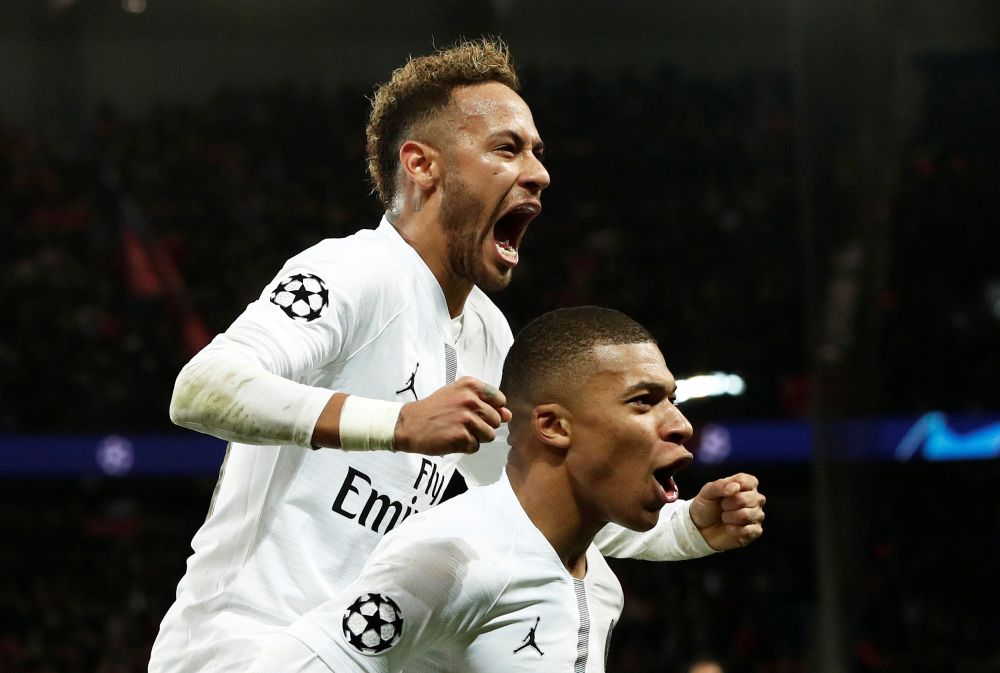 Paris St Germain's Neymar celebrates with Kylian Mbappe after scoring the second goal against Liverpool, November 28, 2018. u00e2u20acu2022 Reuters pic