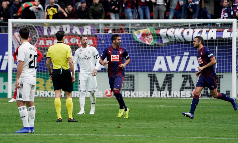 Eibar's Jose Angel celebrates their third goal as Real Madrid's Sergio Ramos looks dejected, Eibar, Spain - November 24, 2018. u00e2u20acu201d Reuters pic
