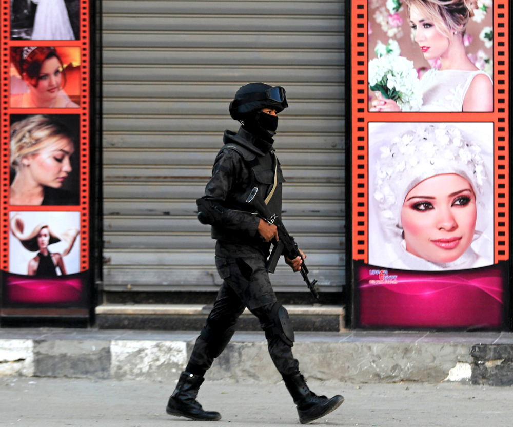 A member of the special police forces guards at the site of the church of Great Martyr Prince Tadros in Minya November 3, 2018. u00e2u20acu201d Reuters pic