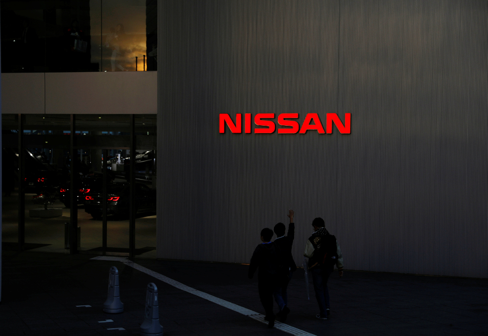 People walk near a Nissan signage at Nissan Motor Cou00e2u20acu2122s global headquarters in Yokohama, Japan November 22, 2018. u00e2u20acu201d Reuters pic